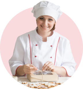 lady smiling confectioner wrapping a box with cookies